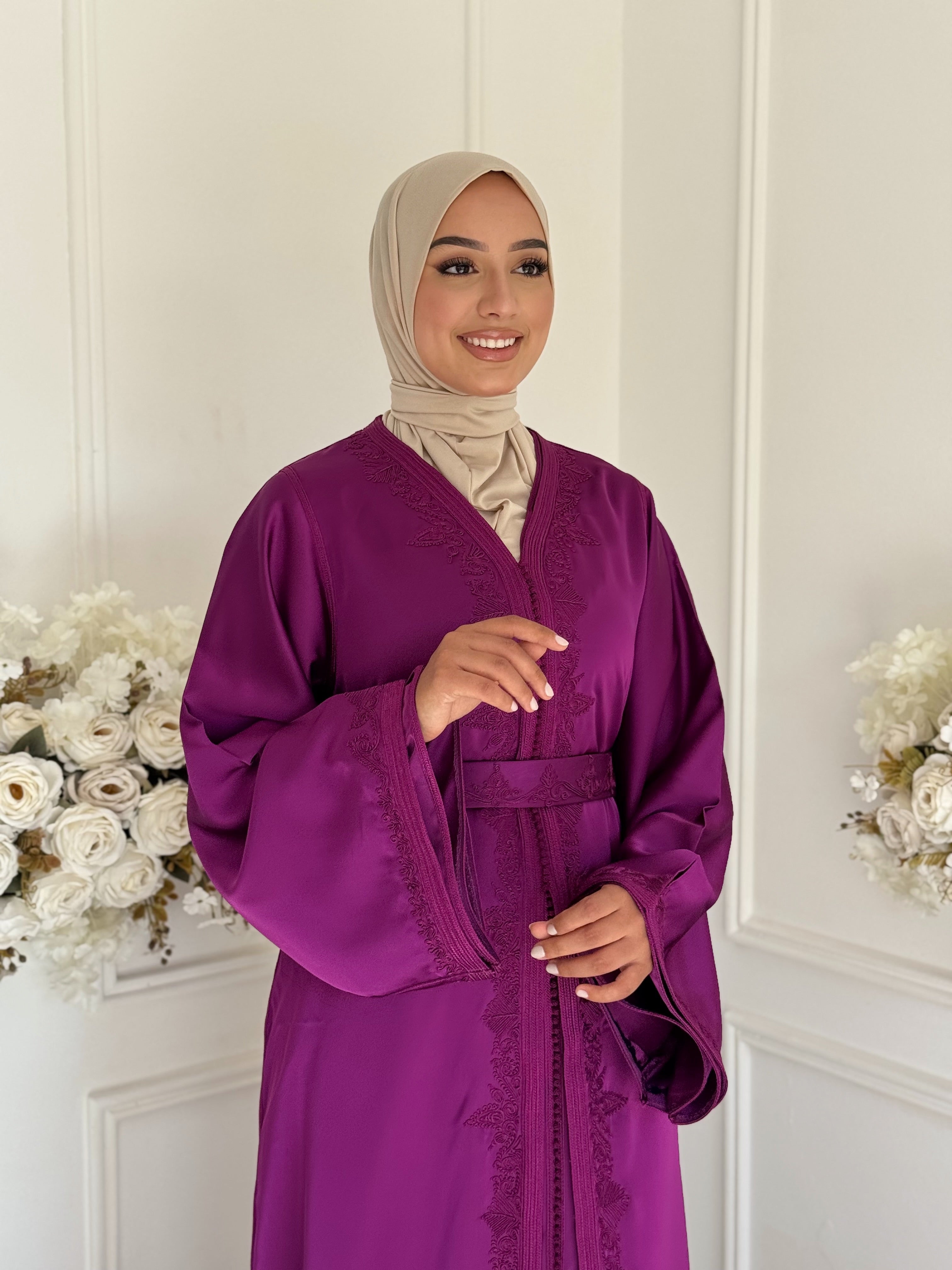 Model wearing Takchita Huda in royal purple drap de soie