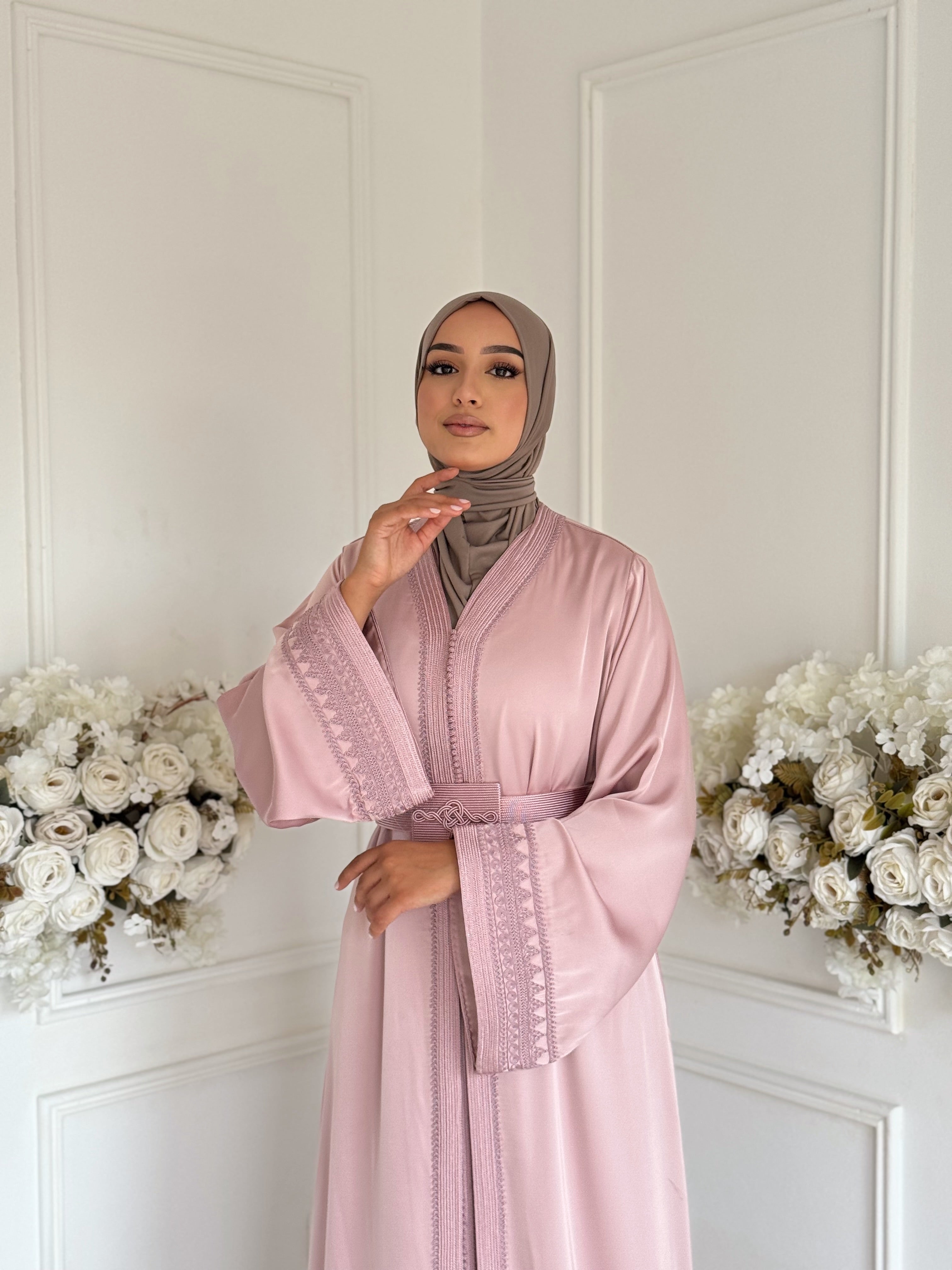 Model wearing Takchita Zahra – blush pink Moroccan two-piece dress with elegant hand embroidery