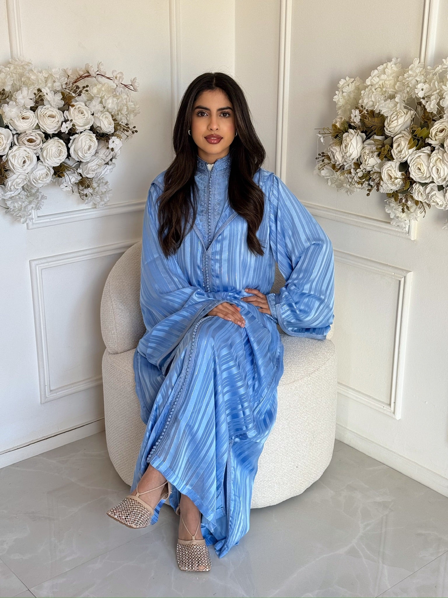 Elegant Moroccan jellaba for women in a soft blue color and modest design.