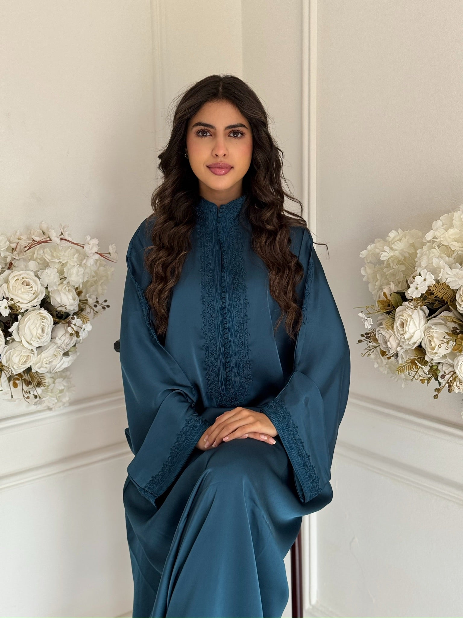 “Model wearing the blue Gandoura Hasiba Moroccan dress in drap de soie silk.