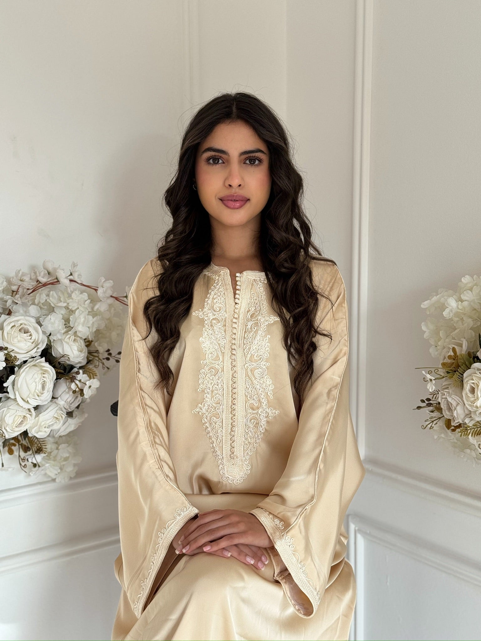 Model wearing the ivory Gandoura Romayssa Moroccan dress made from drap de soie