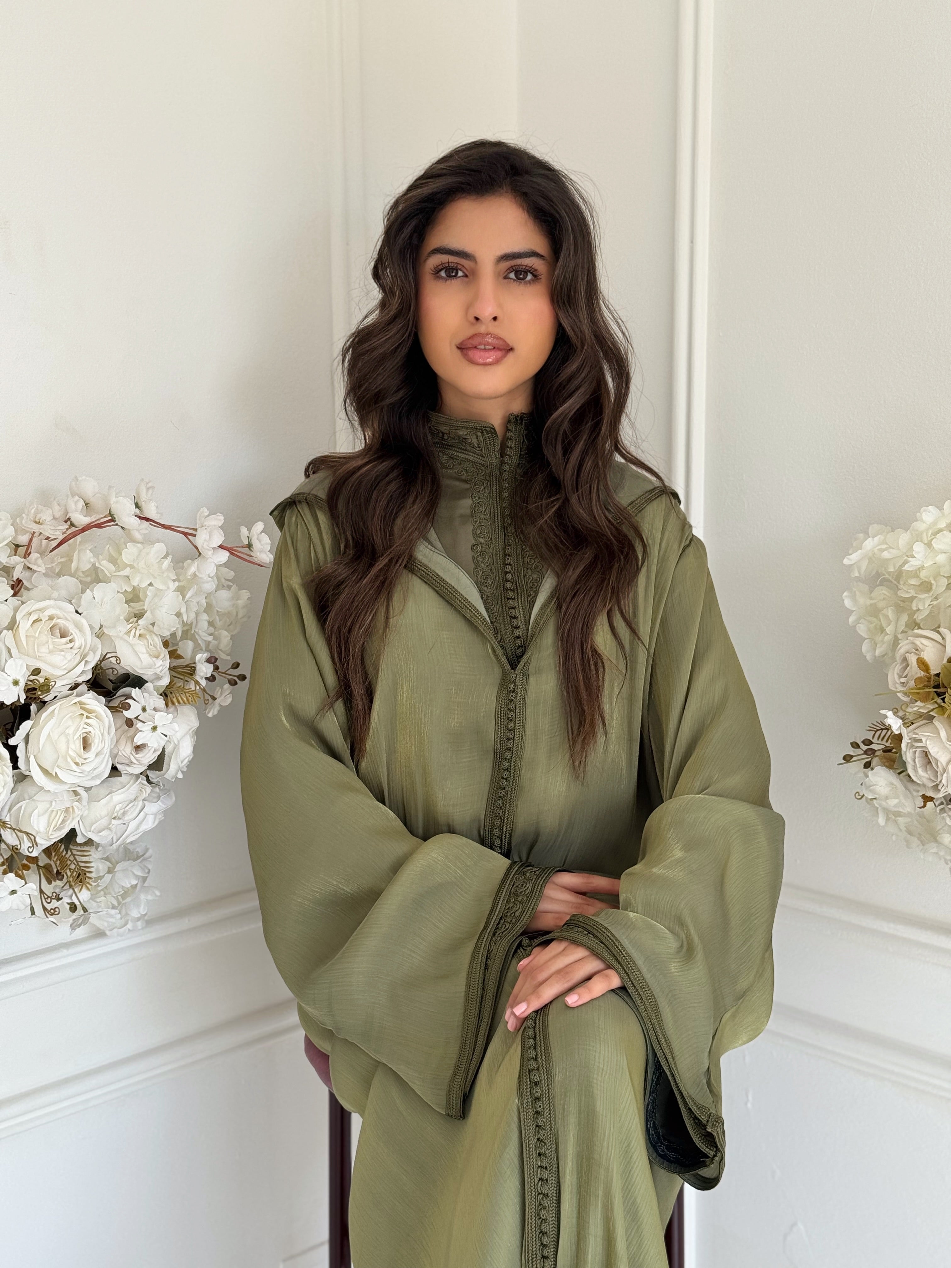 Model wearing Jellaba Hana – olive green Moroccan jellaba with subtle embroidery