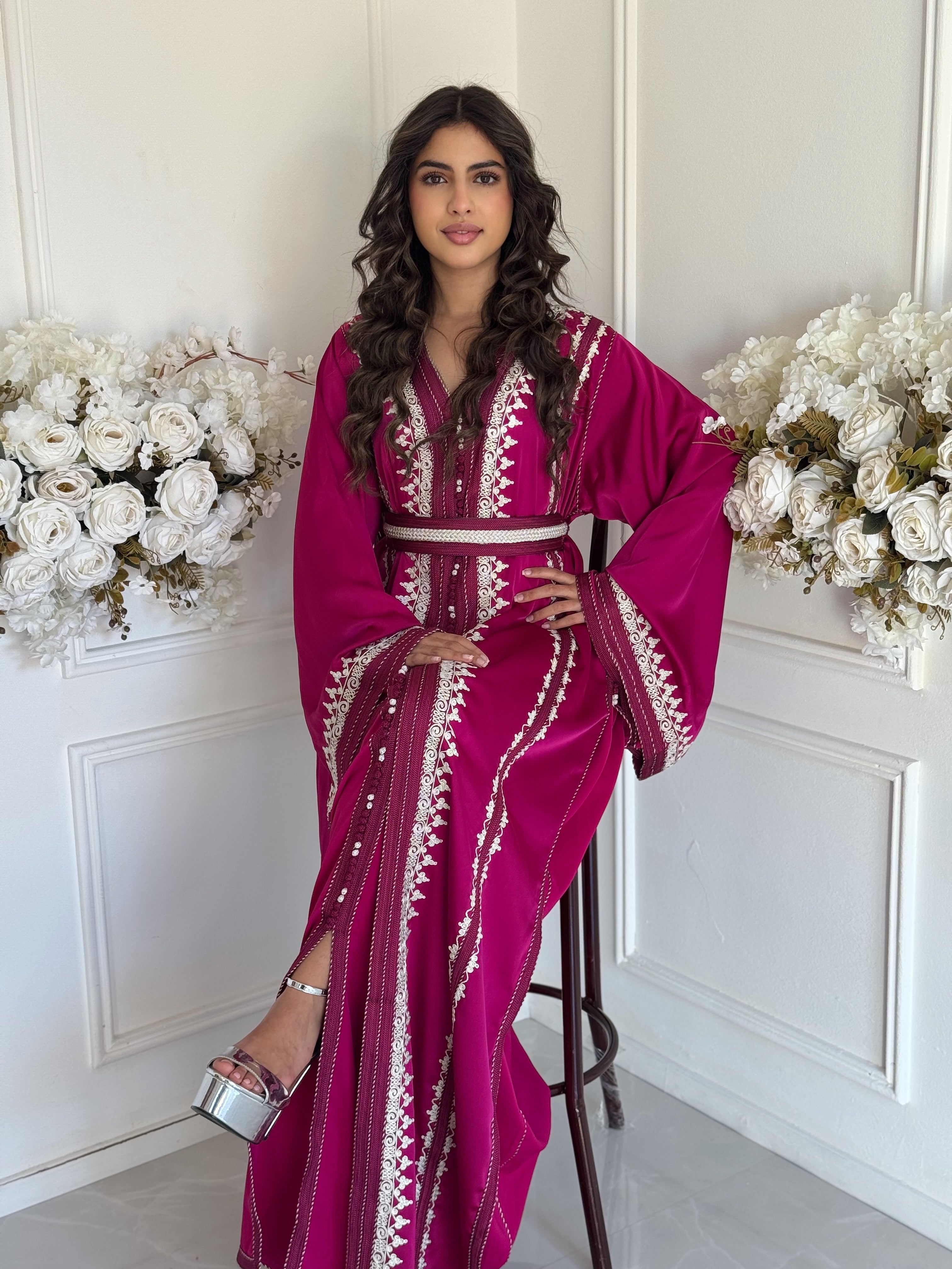 “Close-up of Takchita Nabila showing traditional Moroccan embroidery and fine satin finis