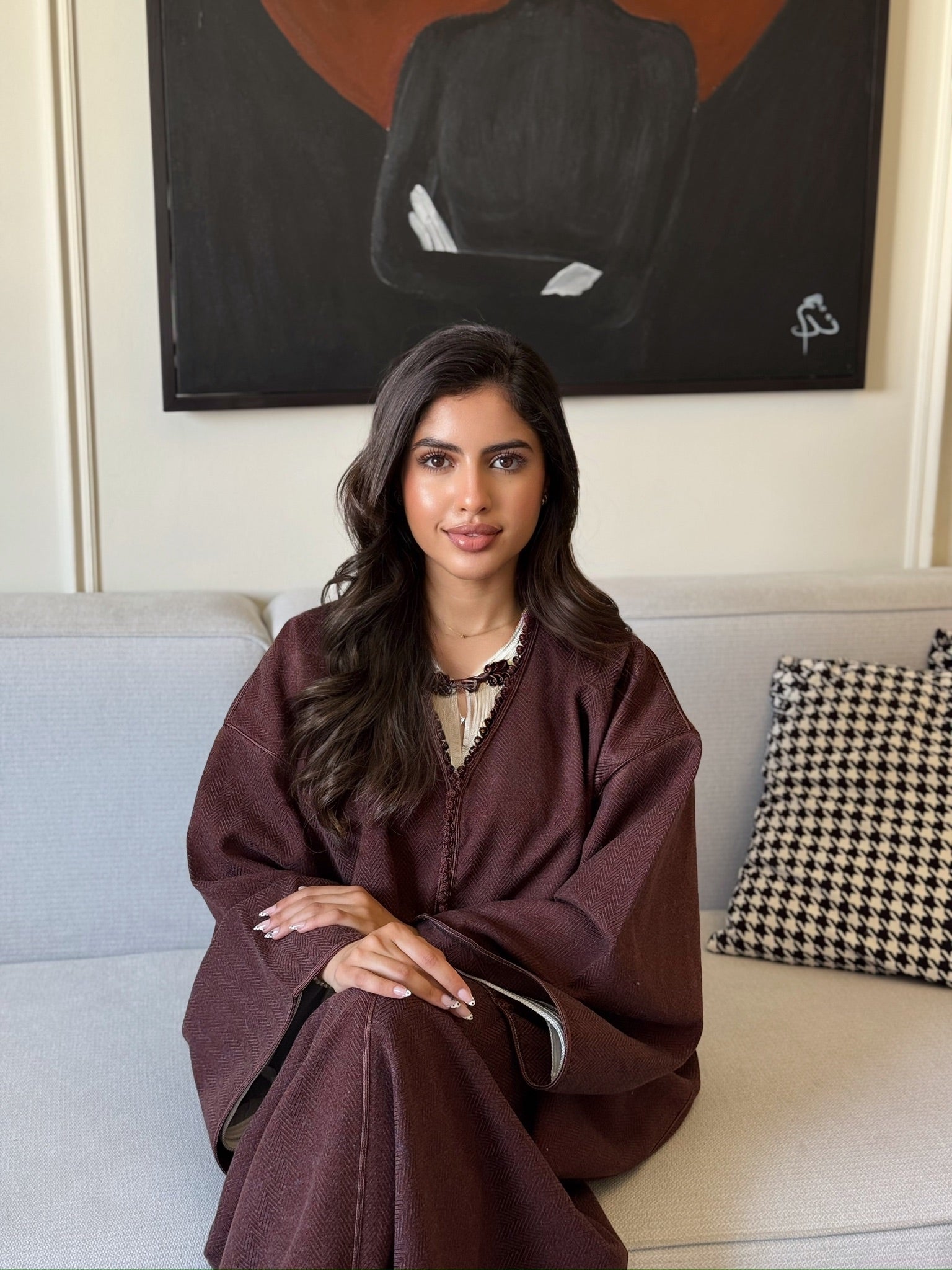 Elegant burgundy caftan styled for Eid celebrations and special occasions