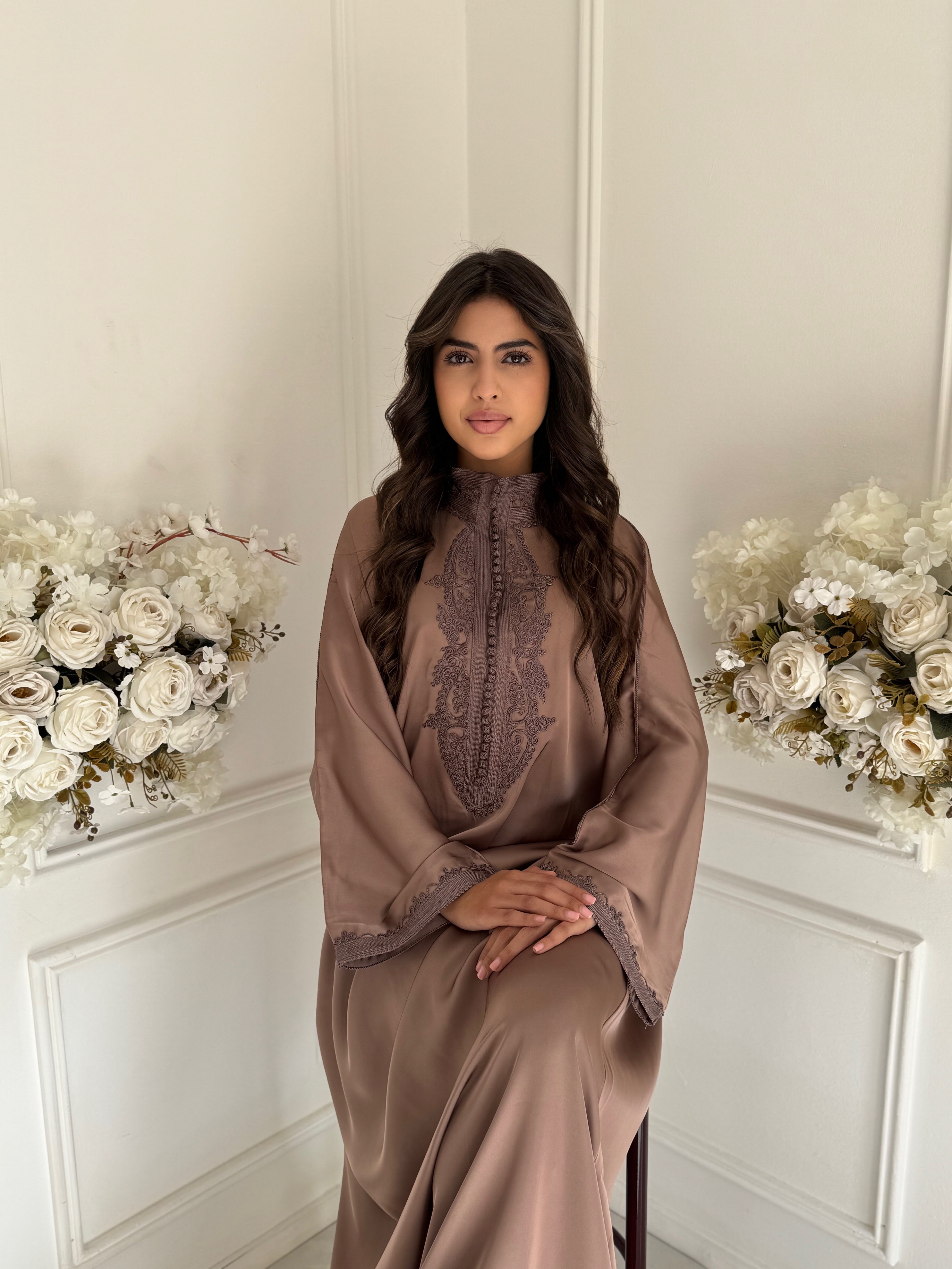 “Model wearing Gandoura Maya — taupe Moroccan gandoura in silky drap de soie fabric.”