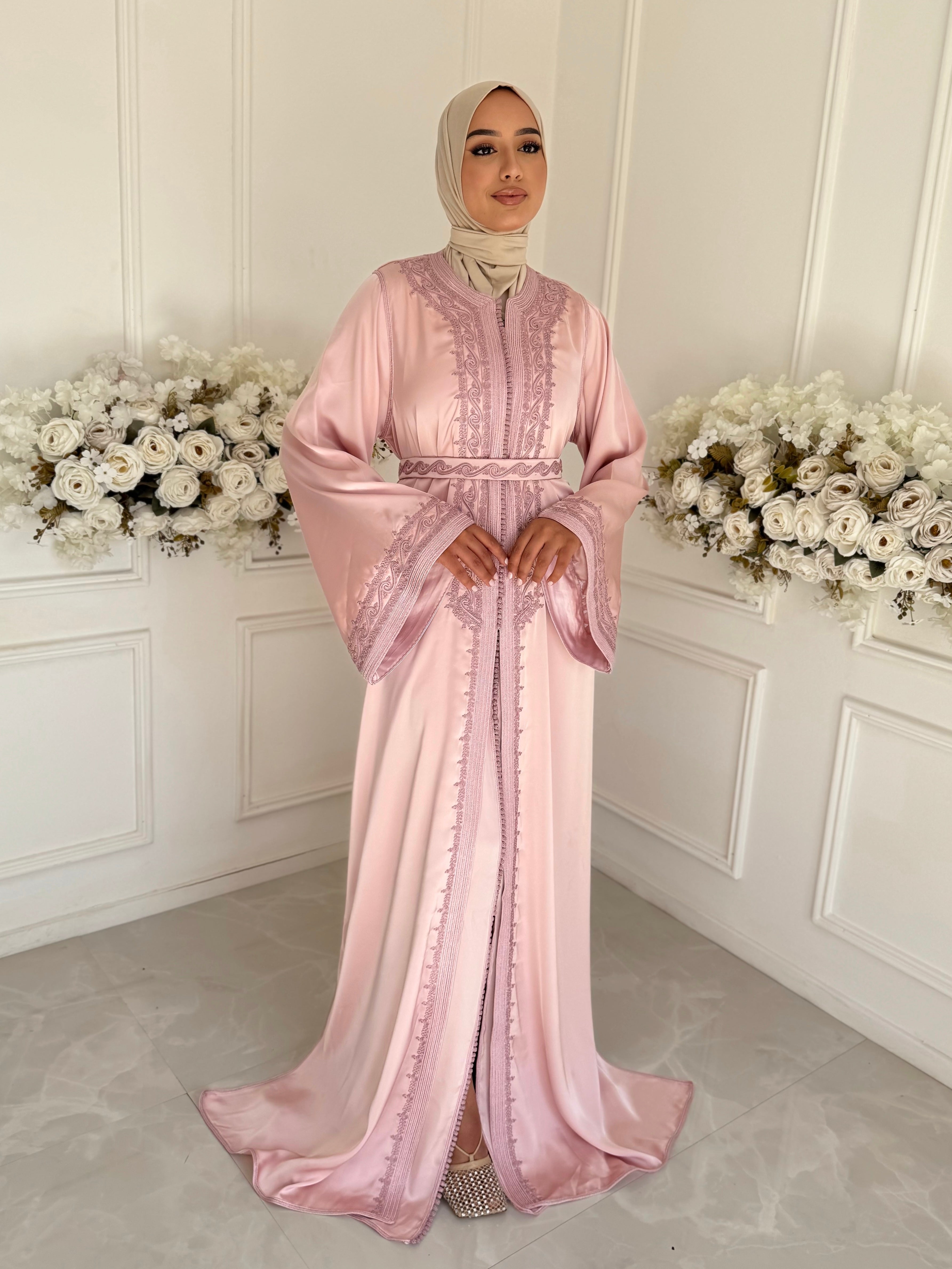 Full-length view of Takchita Amaya – elegant light-pink satin Moroccan dress.”