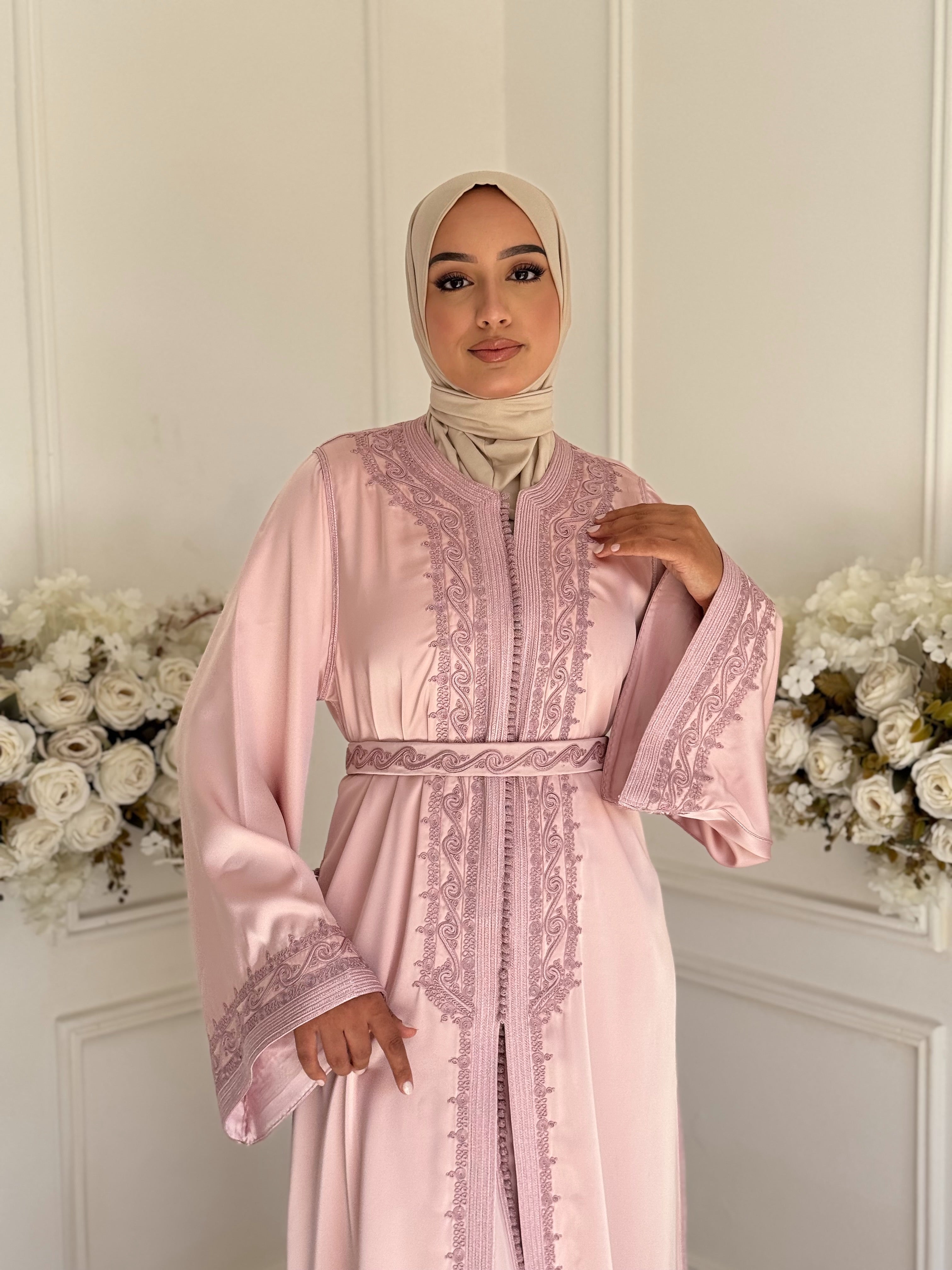 Model wearing Takchita Amaya – pink Moroccan satin gown with embroidery details.