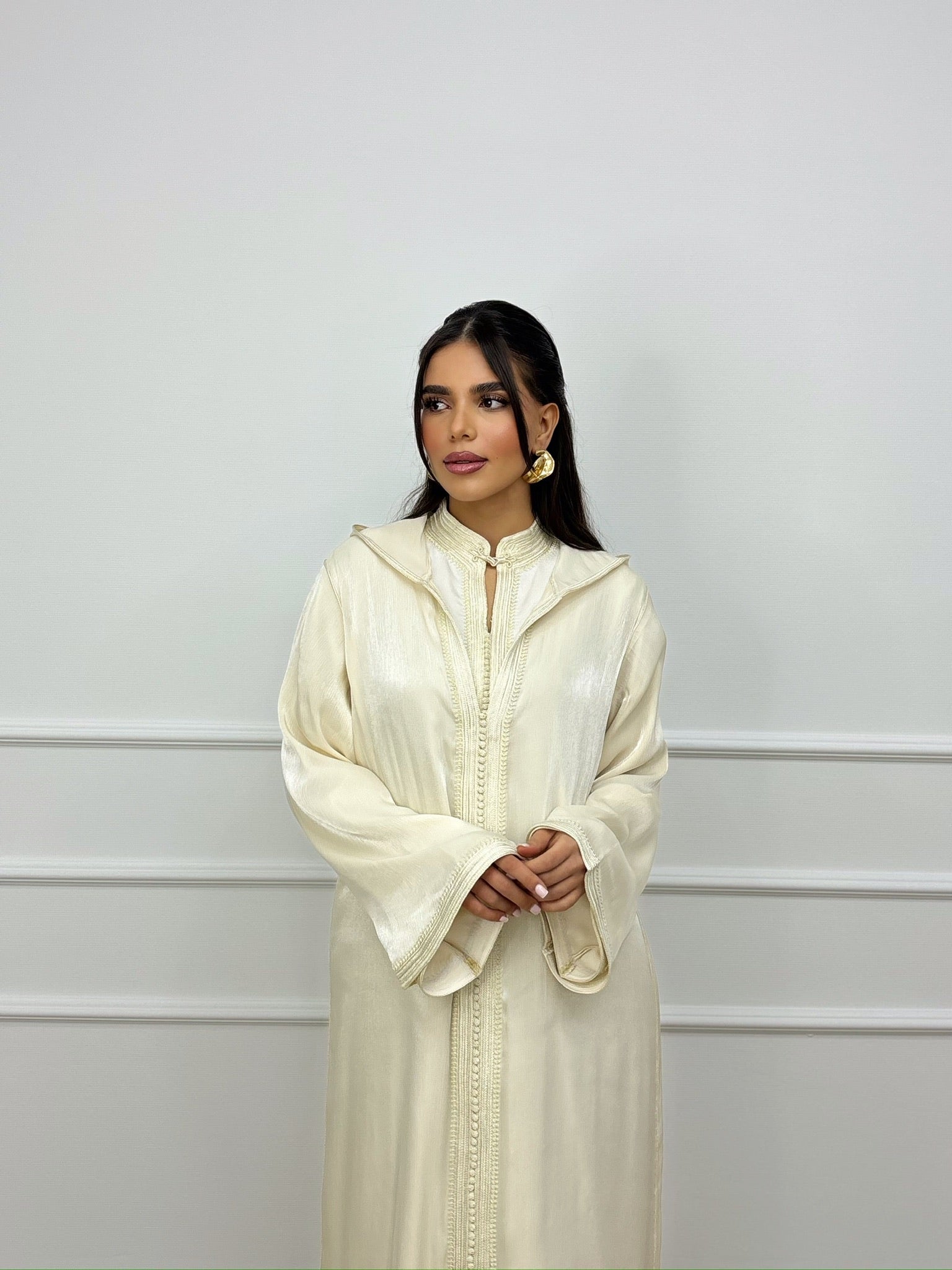 organza Moroccan jellaba with elegant detailing displayed in a soft, minimal interior